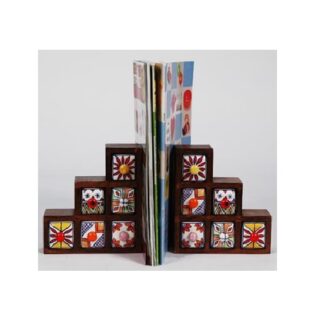 Ceramic Decorative bookends with a book placed between them Bookends are used to keep books upright on a shelf or desk they come in various materials, including metal, wood, stone, and fabric. Bookends can be functional and decorative, adding to the aesthetic of a space the term "bookend" #9082